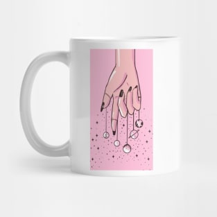 Hands holding Planets from a String Mug